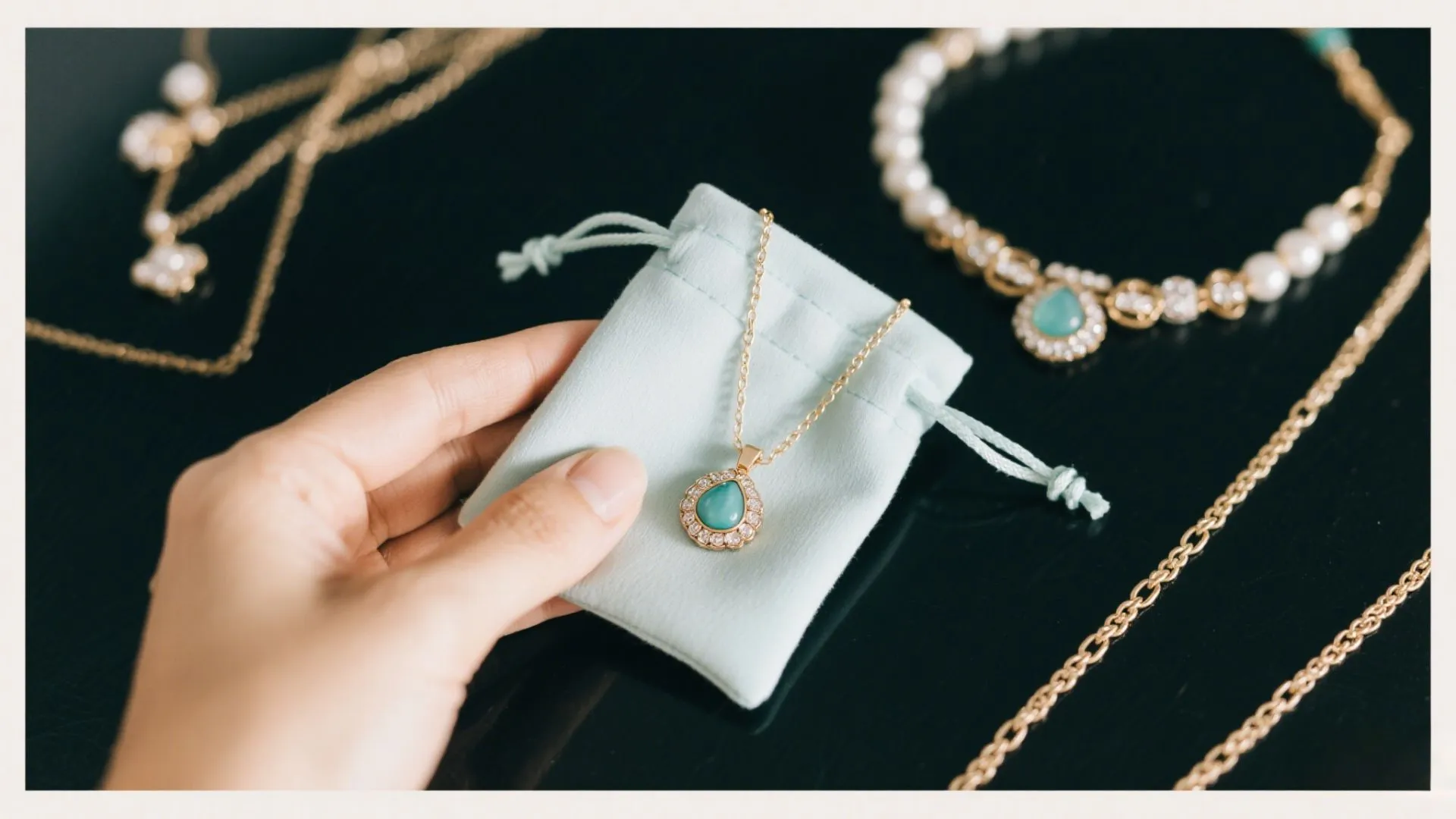 a women presenting a small blue velvet jewelry pouch