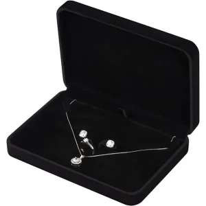Black velvet jewelry box displaying a silver necklace and matching earrings and ring set, all with sparkling gemstones.