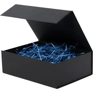A black gift box with its lid open, filled with blue shredded paper filler.