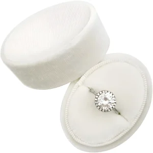A stunning diamond ring nestled in a plush, white velvet jewelry box.