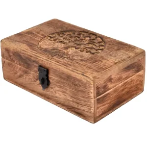 A wooden storage box with a rustic finish features an intricately engraved tree-of-life design on its lid and is secured with a black metal latch.