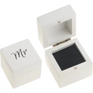 White wooden jewelry boxes with "Mr" monogram on one, featuring a black interior lining and brass hinges.