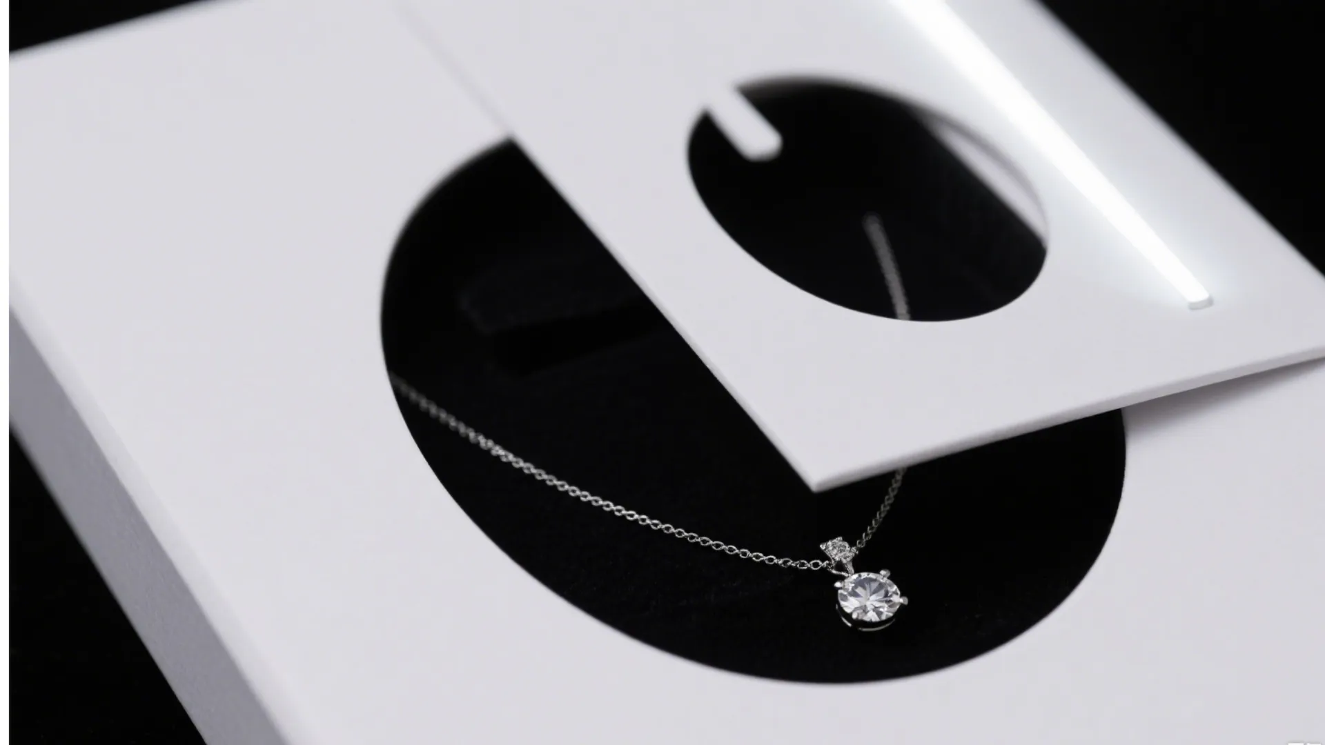 white jewelry box with necklace and cutout design