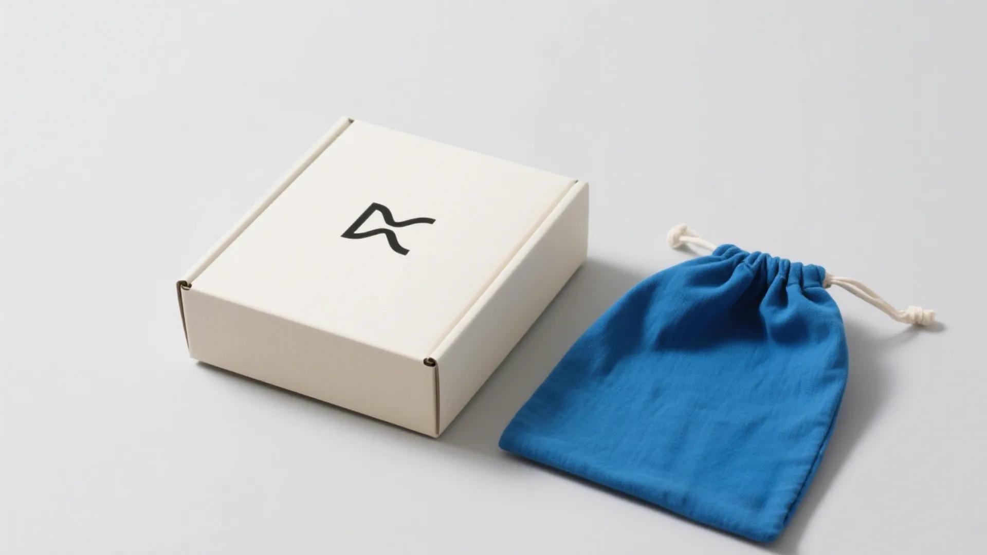 box and blue drawstring pouch