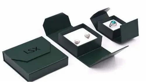 green jewelry boxes with earrings ring