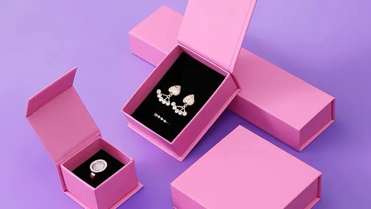 pink jewelry boxes with earrings display
