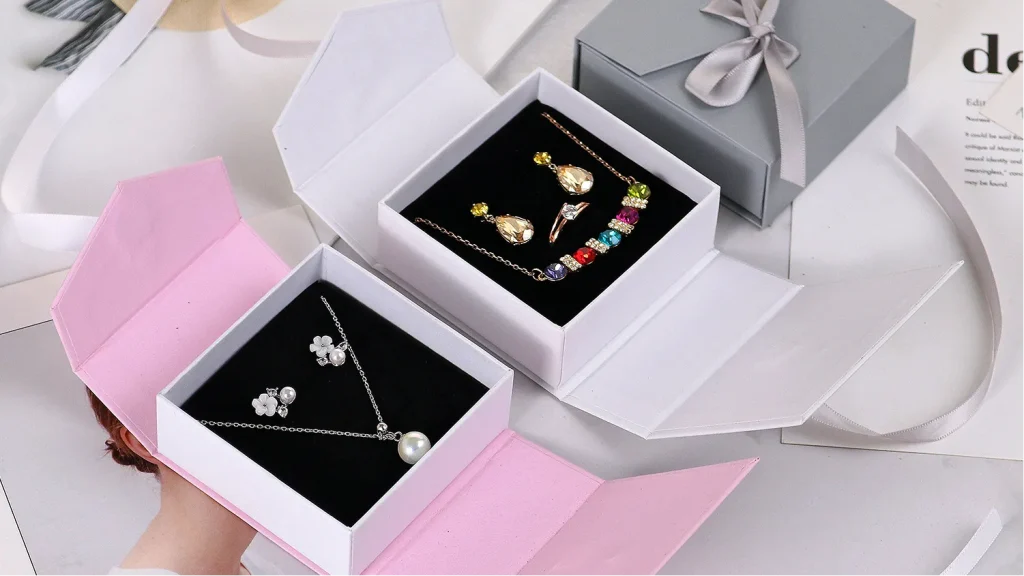 pink white jewelry box with necklace earrings