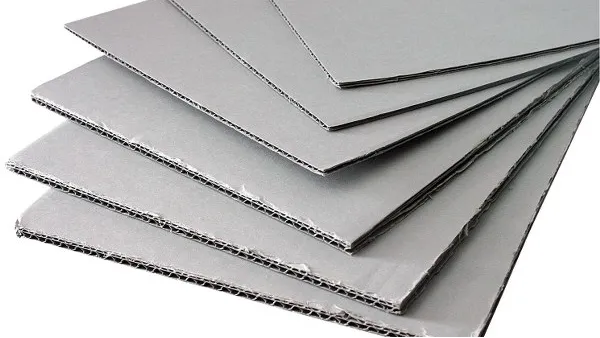 stacked grey corrugated cardboard sheets