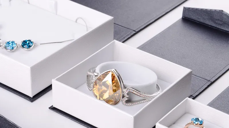 white jewelry box with gemstone accessories
