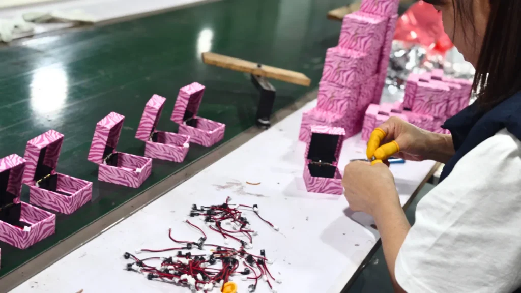 worker assembling small components in richpack factory