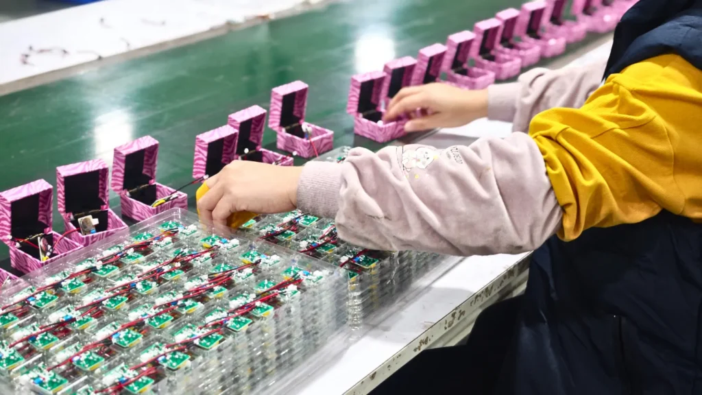 worker processing components in a manufacturing setup