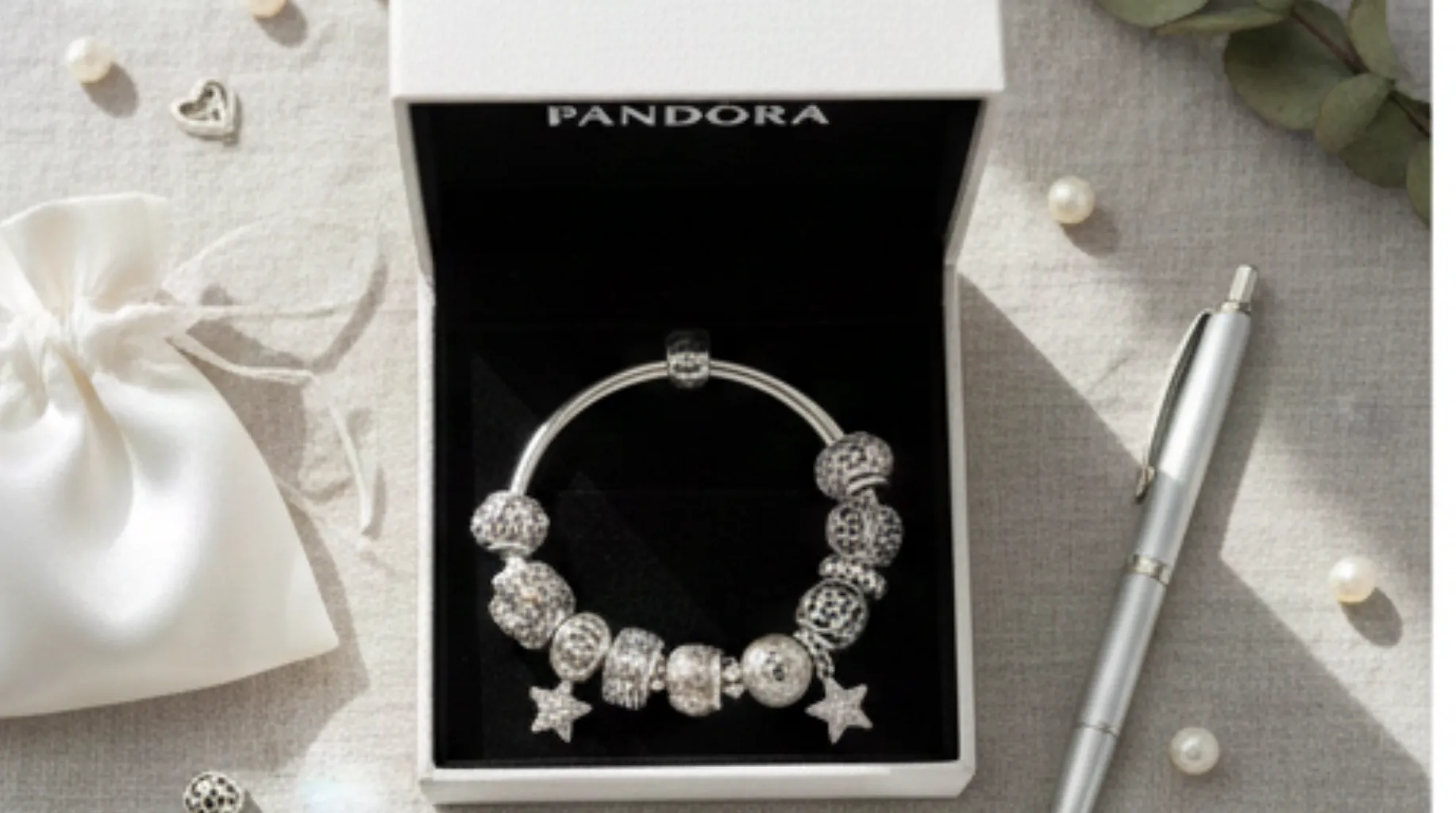 Pandora silver charm bracelet (with star & crystal beads) in branded gift box, styled with pearls & silk pouch