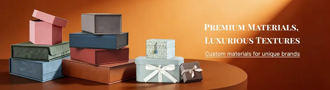 Asortiman vrhunskih poklon kutija u različitim bojama i teksturama, s luksuznim materijalima za prilagođeno pakovanje.