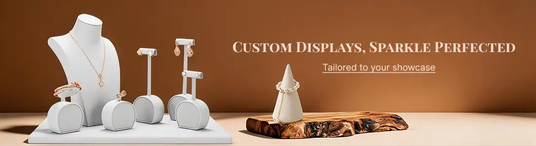 White custom jewelry display set including bust, earring stands, ring holders, and bracelet cone, designed to showcase fine jewelry.