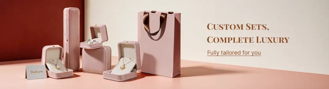 Pink velvet custom jewelry packaging set, including boxes, long case, paper bag, and thank-you card, for luxury gifting.